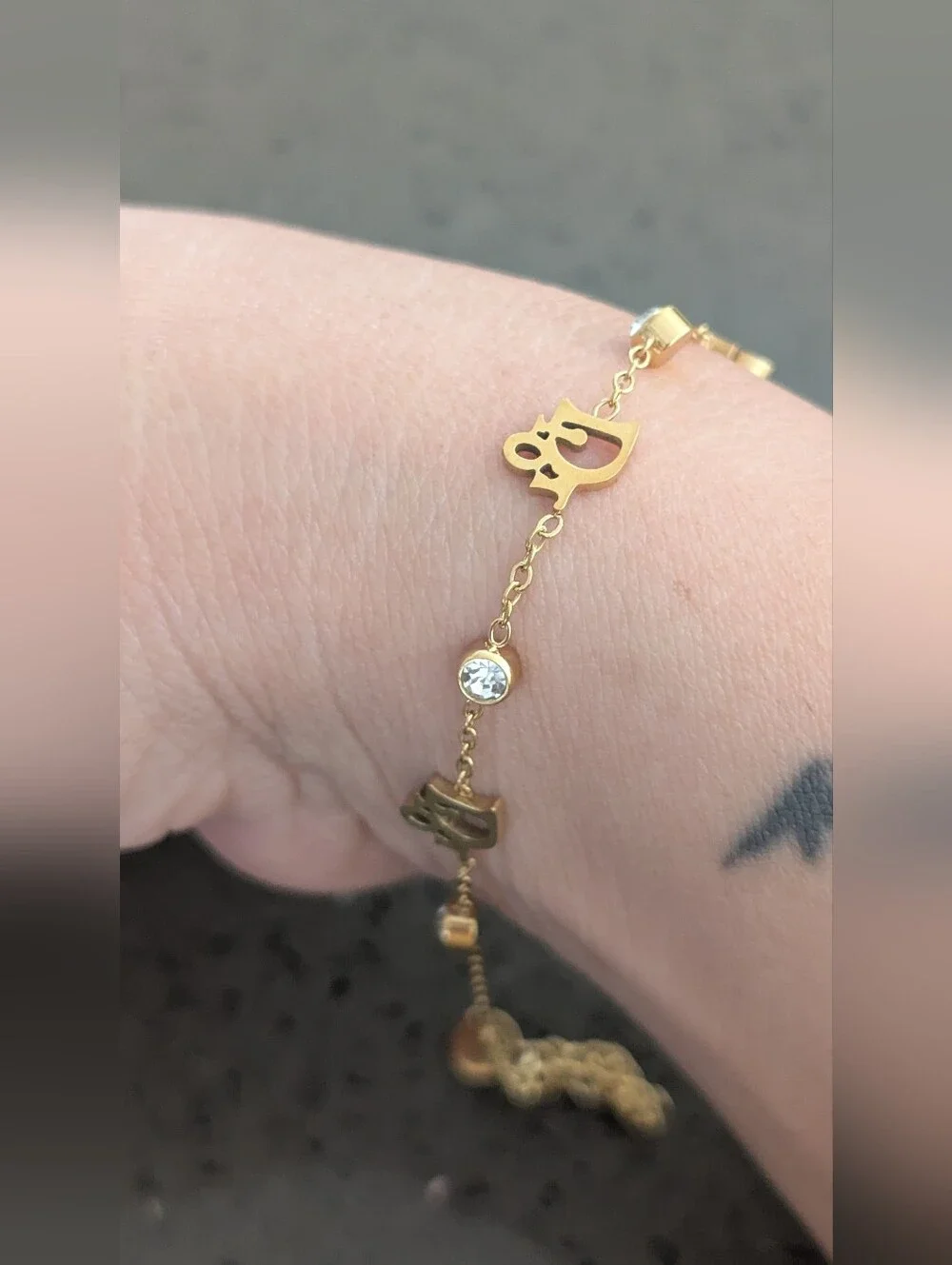 Gold-Tone Script Charm Bracelet with Clear Crystal Accents Stainless Steel